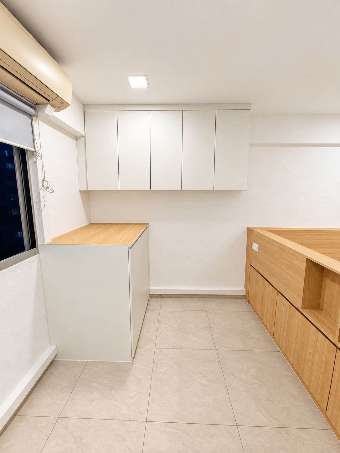 Side view showing the study desk, oak countertop and overhead cabinets beside the platform headboard