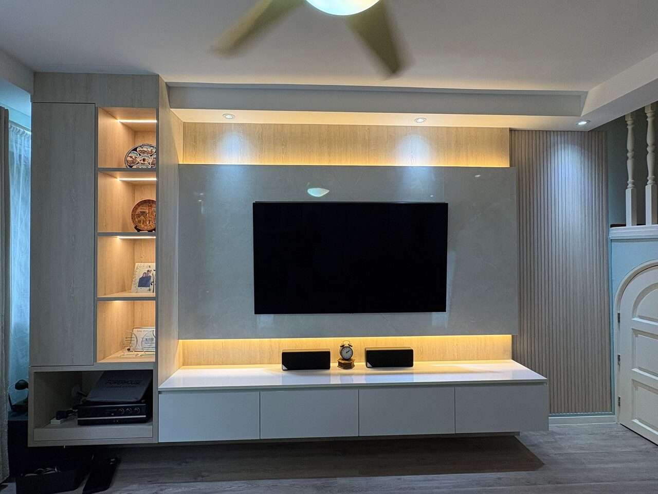 Simei HDB sintered-marble TV feature wall with lit oak display tower