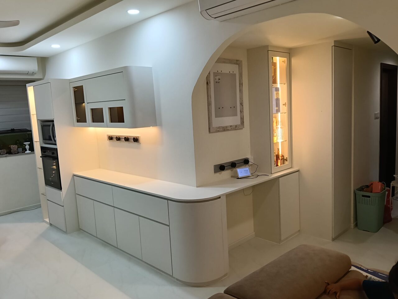 Kitchen — arched display, lit and warm