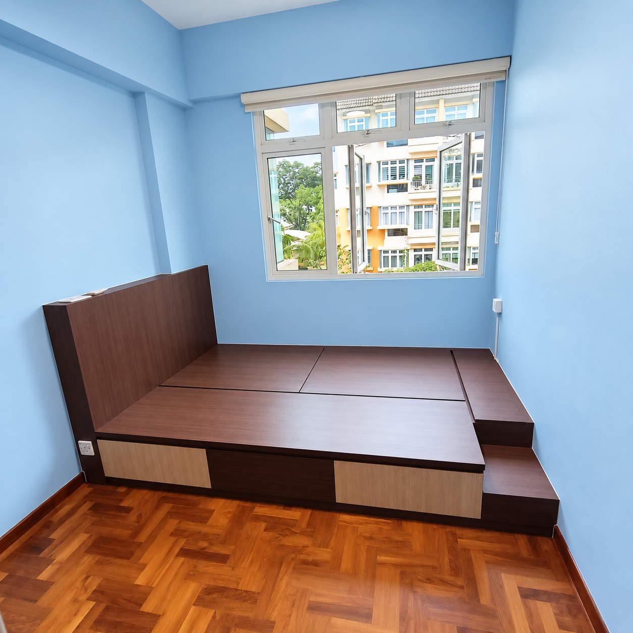 Side view of the empty walnut platform with step storage and headboard panel